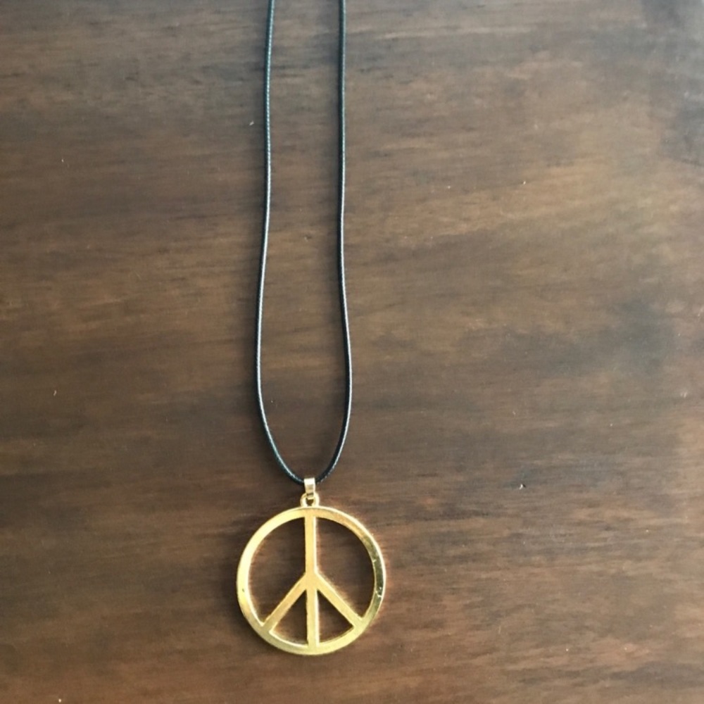 Gold metal peace necklace